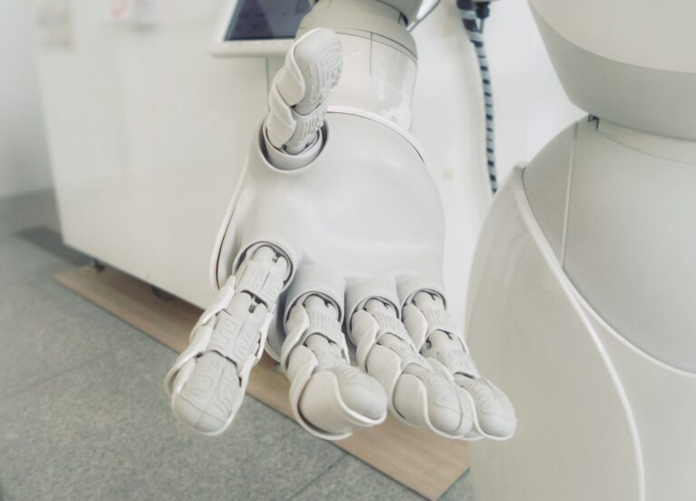 A robotic hand reaching out to the viewer.